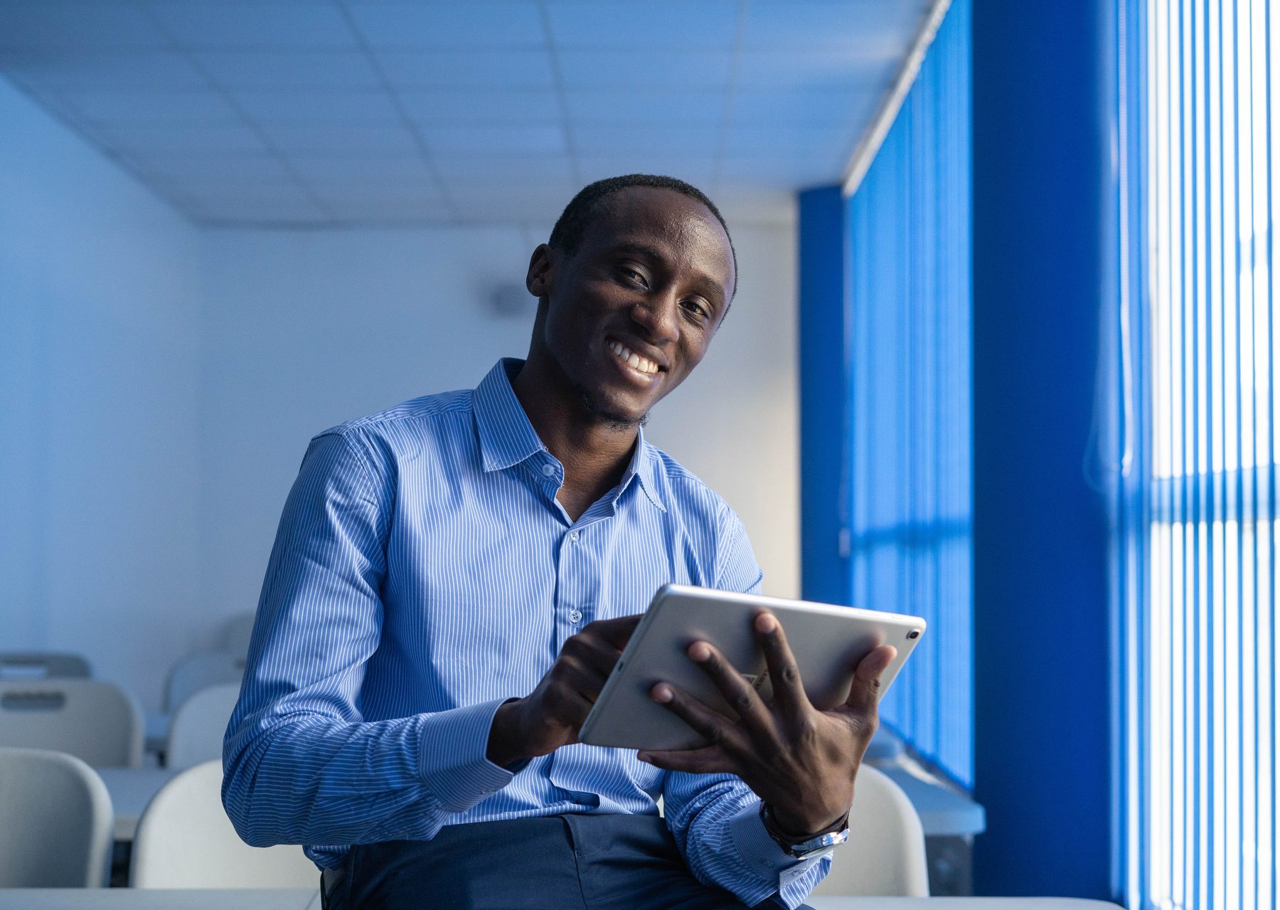 Solicitor with a tablet in a modern London office