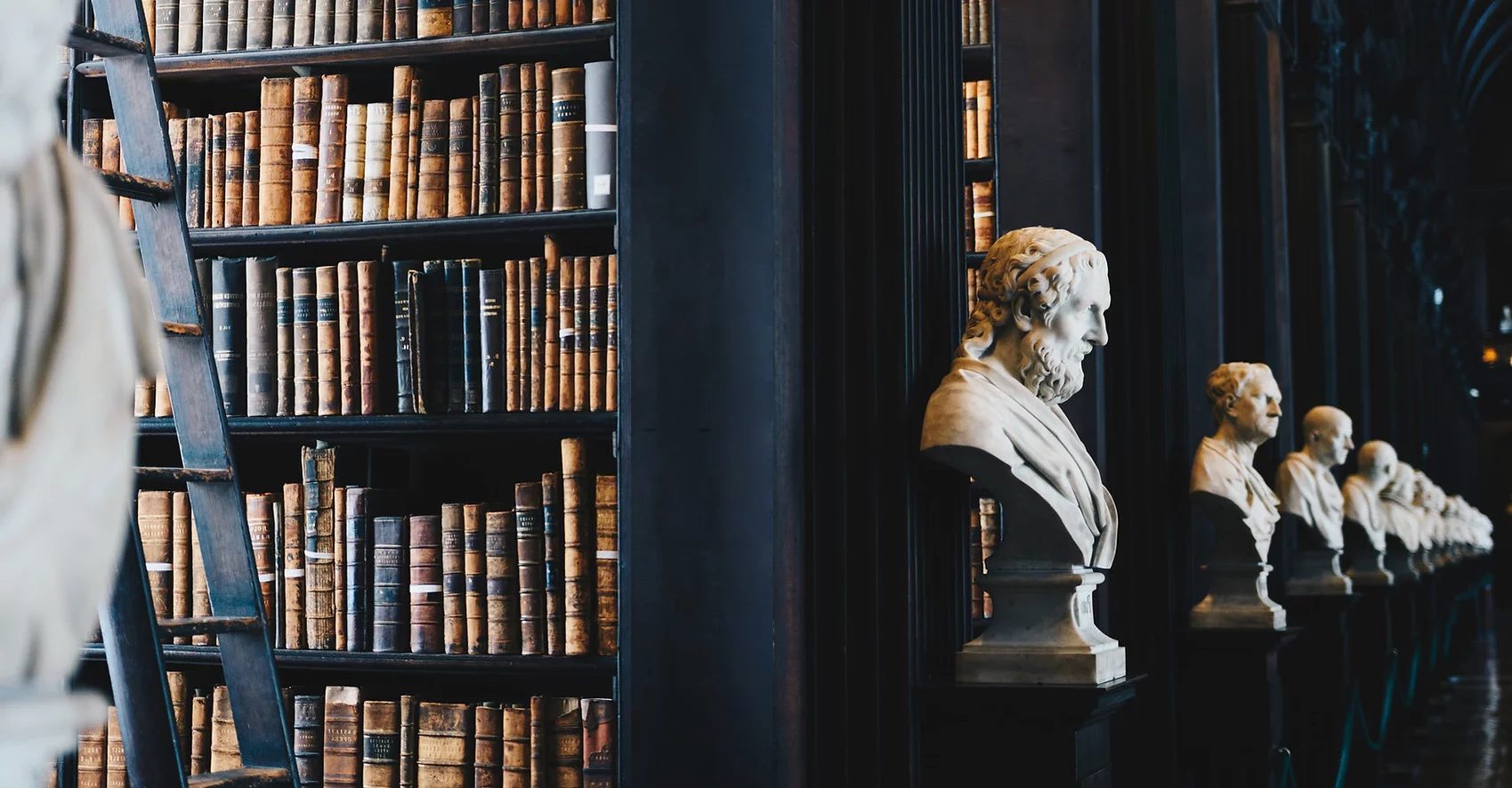 Law library with legal reference books and classical busts